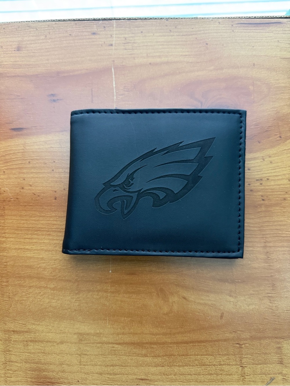 Philadelphia Eagles Men’s Black Bi-Fold Wallet Featuring A Debossed Team Logo